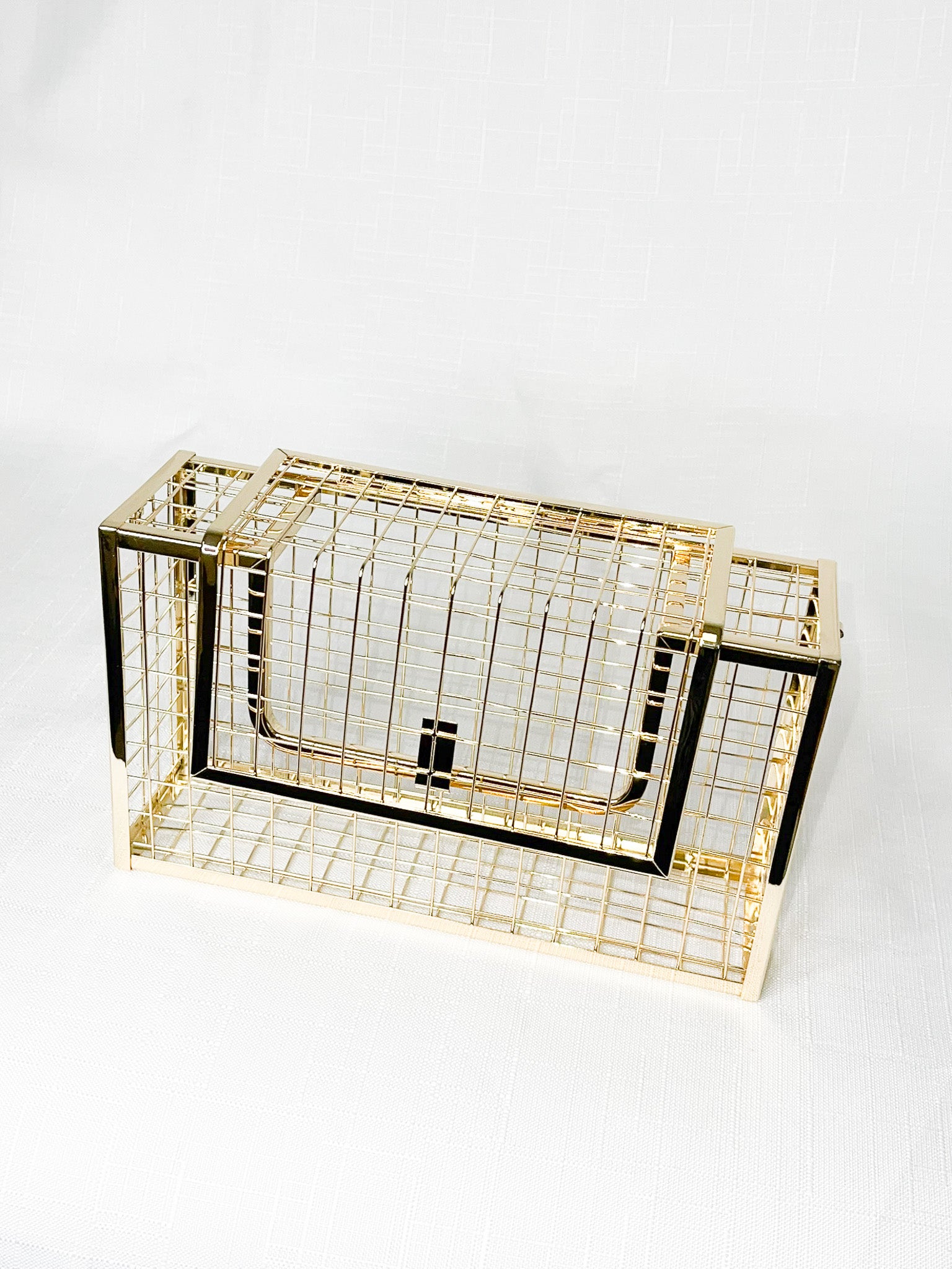 Gold cage best sale clutch bag